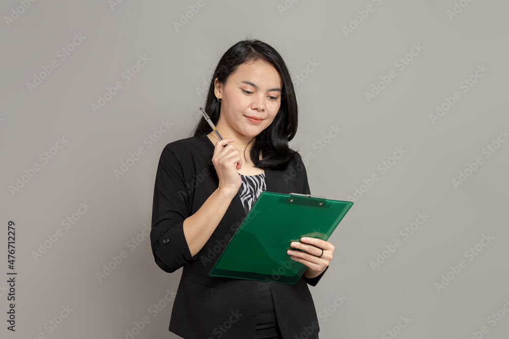 Beautiful woman holding clipboard and pen Beautiful woman holding clipboard and pen
