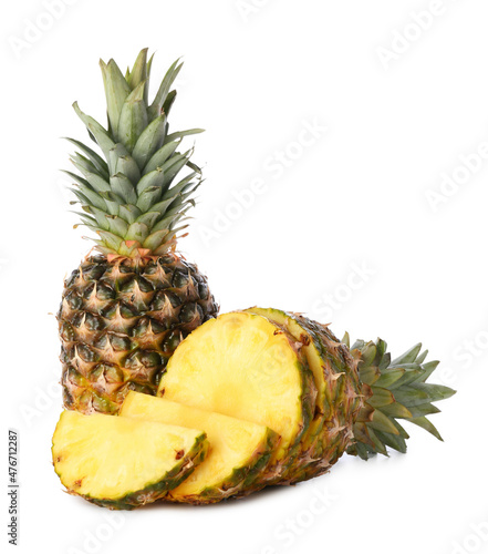 Fresh whole and cut pineapple on white background
