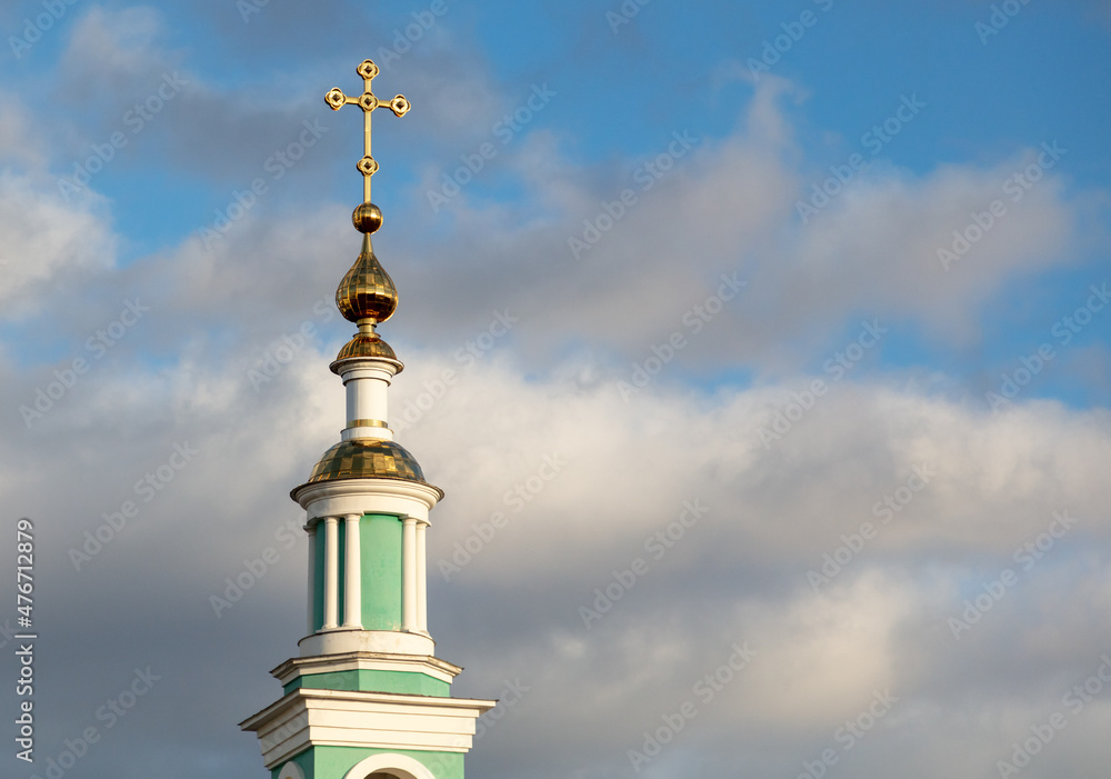 Gold crosses on the Orthodox church against the background of the sky