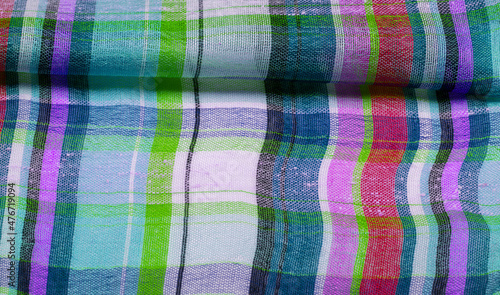 The background texture of the Scottish fabric, the name of which directly indicates the country of its origin. The second and more accurate name of this material is tartan.