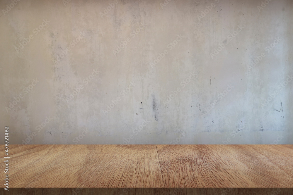 Wooden board empty table in front of concrete background Wooden board empty table in front of concrete background