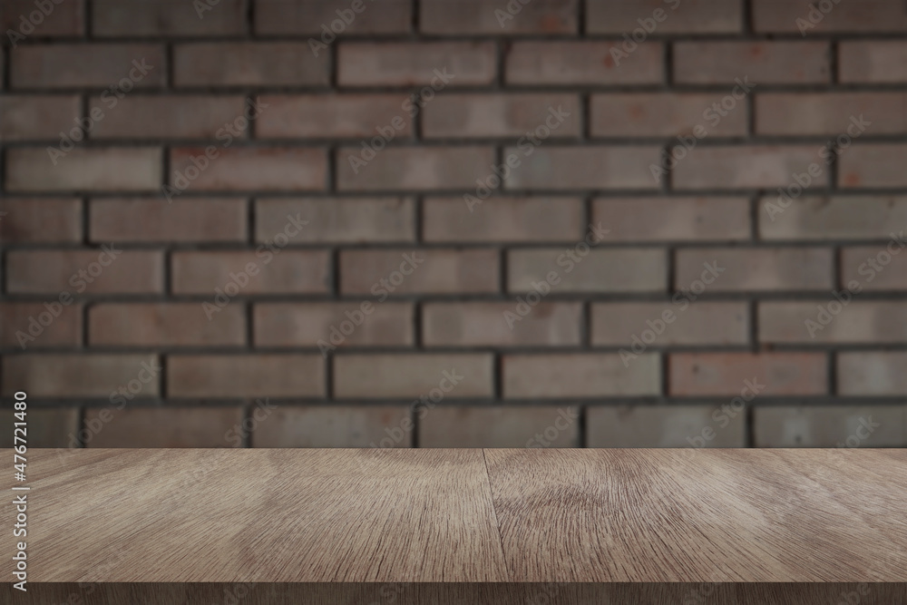 Wooden board empty table in front of light brick wall background. Background blurred. Mock up for display of product