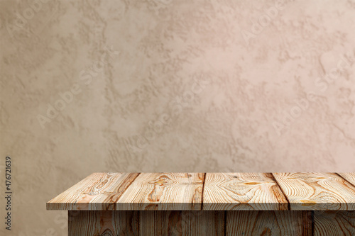 Empty top wooden shelves with plastered wall background