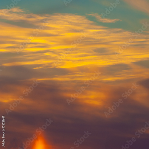 Fototapeta Naklejka Na Ścianę i Meble -  Photo of the sky with clouds, sunrises, sunsets, orange-yellow tones from the setting sun