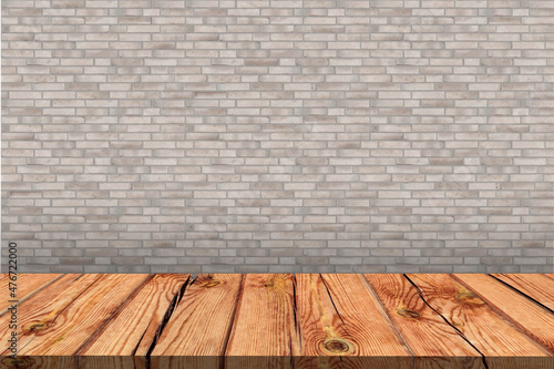 Wooden board empty table in front of light brick wall background. Background blurred. Mock up for display of product.