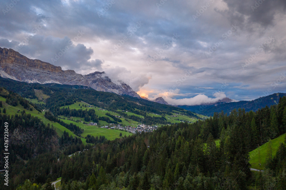 aerial view on sunset in the cloudy dolomites mountains aerial view on sunset in the cloudy dolomites mountains