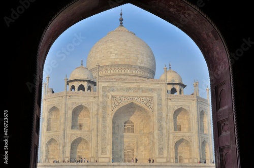 View through an arch to the mausoleum of Taj Mahal