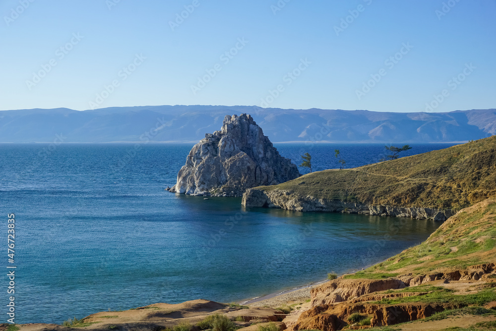 Shaman rock at sunset on Olkhon island at Baikal