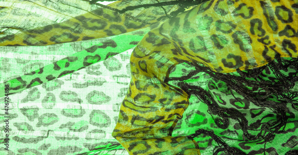 Texture, background, pattern, silk fabric green yellow with leopard print. Lightweight leopard print silk is perfect for your design, looks stylish and not vulgar!