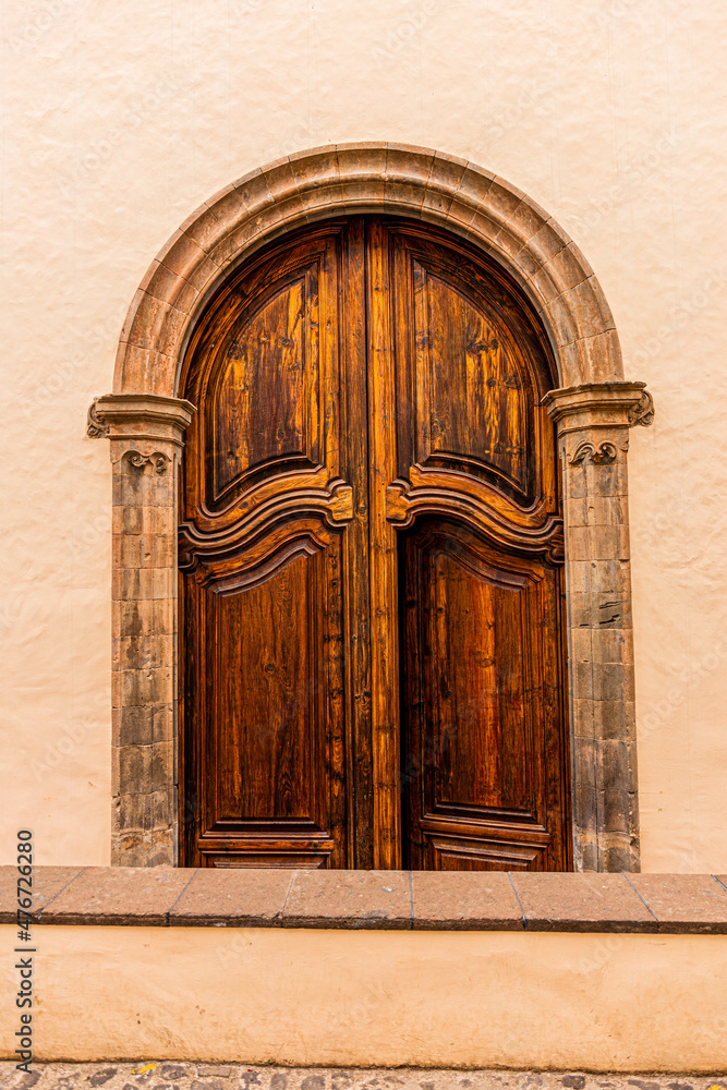 Antique wooden door in the wall in La Orotava, Tenerife