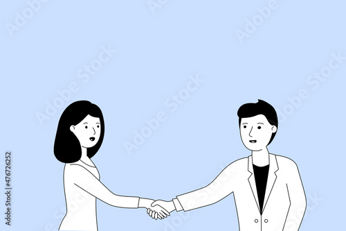 man and woman shake hands