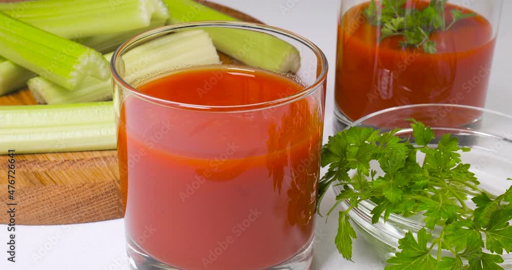 Glasses of tomato juice on the table Glasses of tomato juice on the table