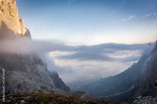 sunrise in the cloudy mountains of dolomites in pale di san martino