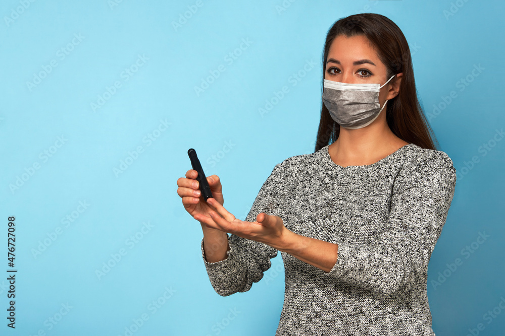Young woman using lancet pen. Diabetes concept Young woman using lancet pen. Diabetes concept