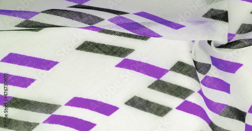 Fototapeta Naklejka Na Ścianę i Meble -  Texture. Background. Template. White silk fabric with purple and black geometric rhombus shapes. violet, violaceous