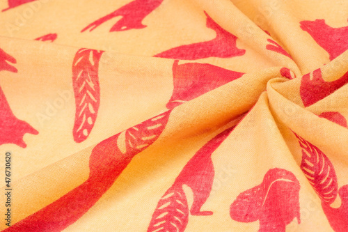 Texture, background, cotton fabric thin yellow with a print of squirrels, martens, sables. Pattern, Decor, Textile, Art, with this fabric you immerse yourself in the world of Rokashi and prosperity photo
