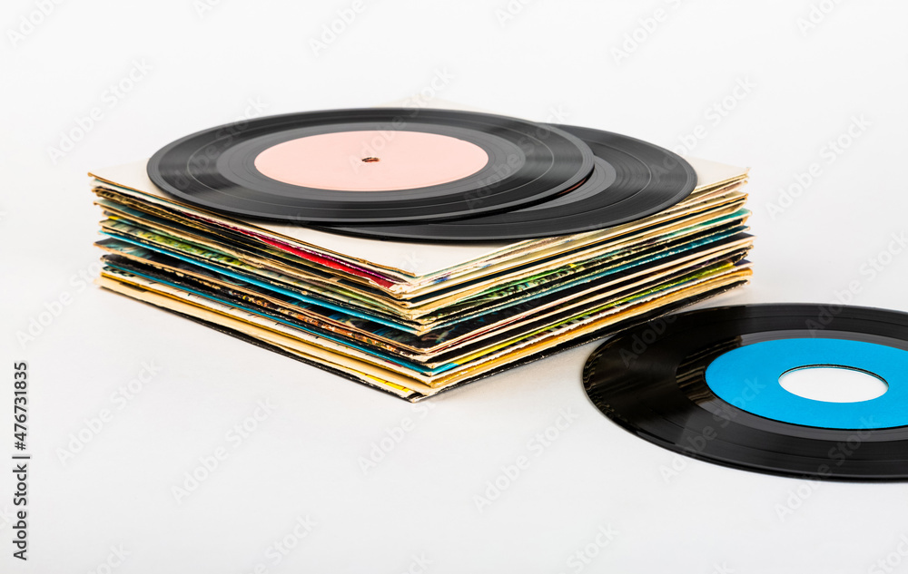 Fototapeta premium Vinyl records in a stack on a white background.