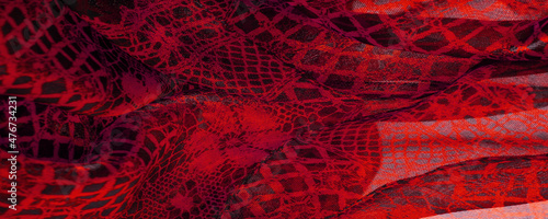 Texture, background, pattern. Ruby red lace fabric, a combination of red with black fabric. blushing, ruddy, florid, gules, blushful photo