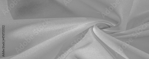 Texture, background, pattern, silk fabric of white color, solid light white silk satin fabric of the duchess Really beautiful silk fabric with satin sheen. Perfect for your design, wedding invitations photo