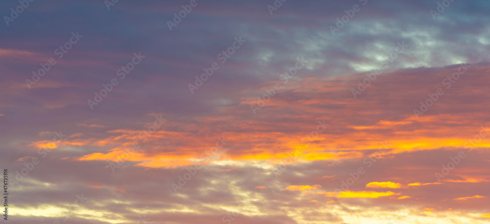 Dawn sunset. Beautiful cloud in pastel colors. Bluish yellow, sky ruby red paint on the sky.   Texture. Background. Template. Panoramic photography