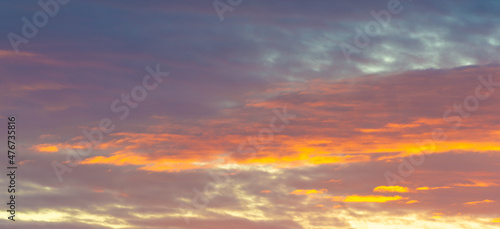 Dawn sunset. Beautiful cloud in pastel colors. Bluish yellow, sky ruby red paint on the sky. Texture. Background. Template. Panoramic photography