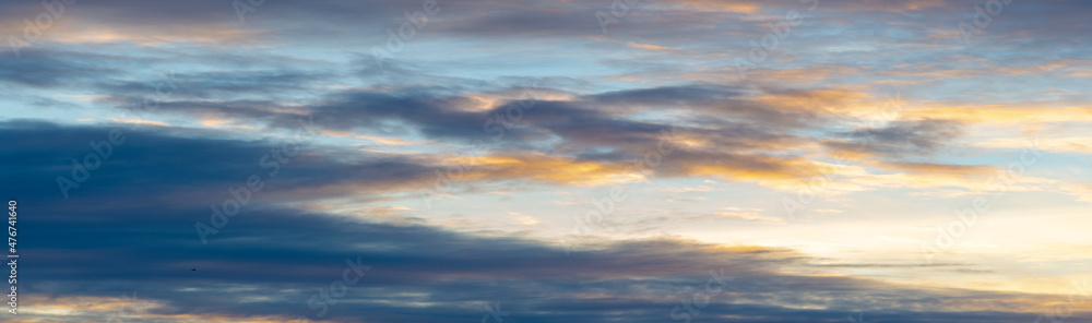 Dawn sunset. Beautiful cloud in pastel colors. Bluish yellow, sky ruby red paint on the sky.   Texture. Background. Template. Panoramic photography