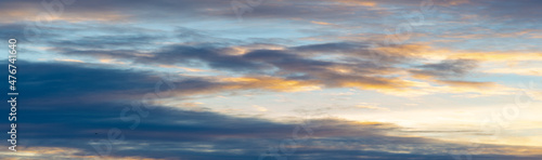 Dawn sunset. Beautiful cloud in pastel colors. Bluish yellow, sky ruby red paint on the sky. Texture. Background. Template. Panoramic photography