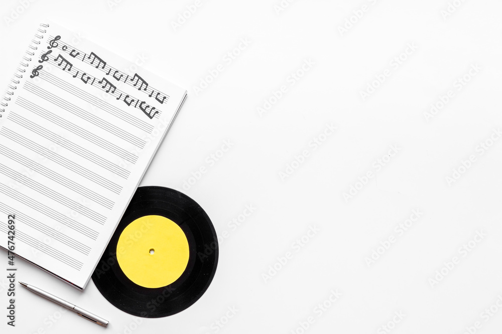 Music sheets with musical notes melody and vinyl record Music sheets with musical notes melody and vinyl record
