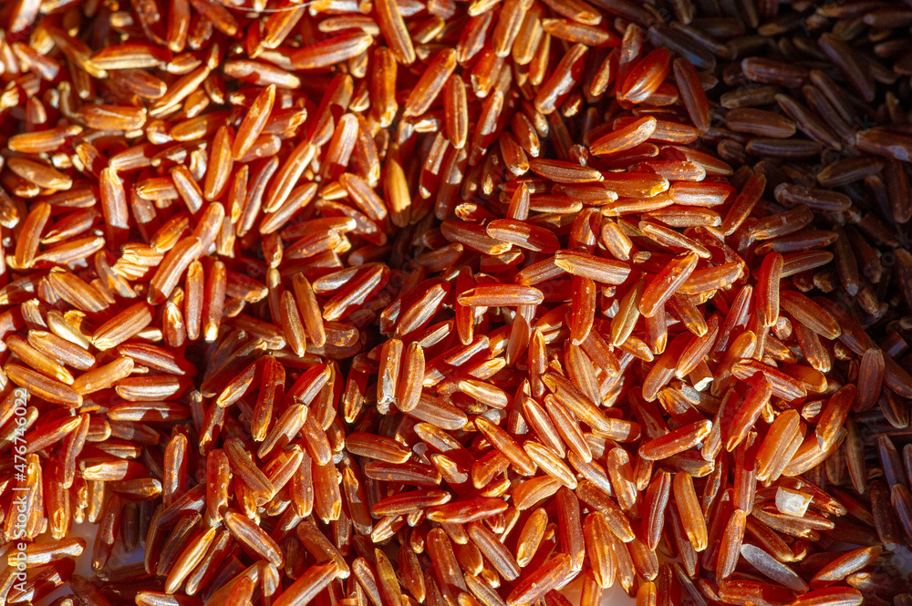 Product photography.  Red rice, gold and black (also called purp