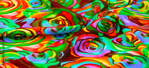 The fabric is bright and colorful, with a pattern of roses all over the fabric, stylized as watercolor paints.