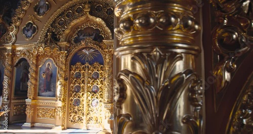 KYIV, UKRAINE � OCTOBER, 02, 2021 Kiev Pechersk Lavra Beautiful interior view incide  Christian Orthodox church. Tracking shot, golden altar 