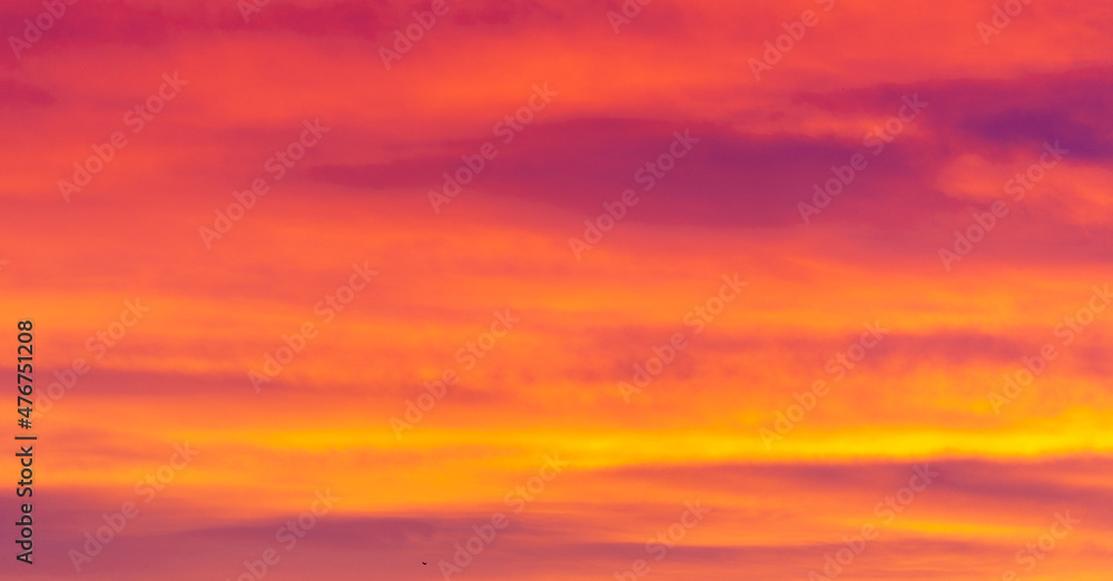 Beautiful morning sky.    Orange red blue paints. Heavenly abstract summer gentle background. Beautiful picturesque bright majestic dramatic evening morning sky at sunset or dawn.