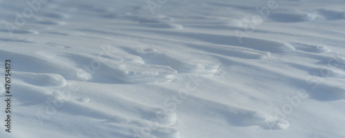 Snow covered the ground. Sunny day. Panoramic photography. Soon the warm spring sun will melt the winter snows. consists of many soft white pieces of frozen water that fall from the sky