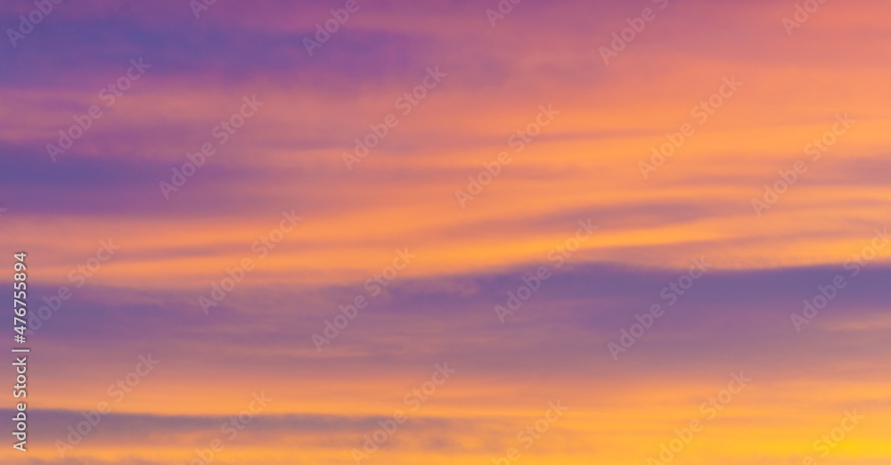 Beautiful morning sky.    Orange red blue paints. Heavenly abstract summer gentle background. Beautiful picturesque bright majestic dramatic evening morning sky at sunset or dawn.