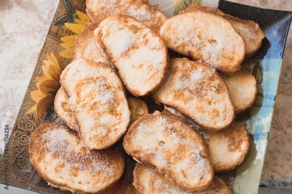 Toast fried in egg and sprinkled with sugar Toast fried in egg and sprinkled with sugar