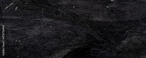Charcoal black silk fabric with sequins and yarns over the surface of the fabric. This ombre tulle in black with abstract embroidery, embellished with sequins and yarns from a European designer