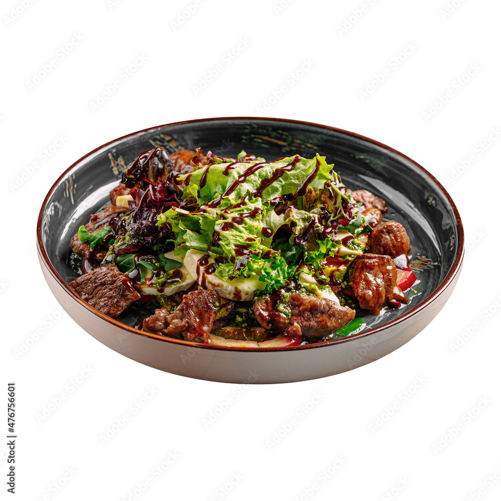 Isolated gourmet warm veal salad with greens Isolated gourmet warm veal salad with greens