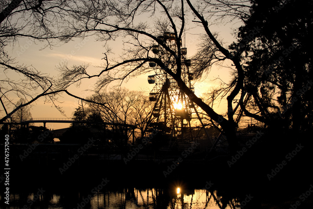 Silhouette of a ferris wheel in an amusement park at sunset, Japan Silhouette of a ferris wheel in an amusement park at sunset, Japan