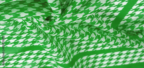 Texture, background, pattern, silk fabric, the brightness of green color on a white background. Pattern on the fabric ala famous French fashion designer. projects will fulfill your desires you are kno photo