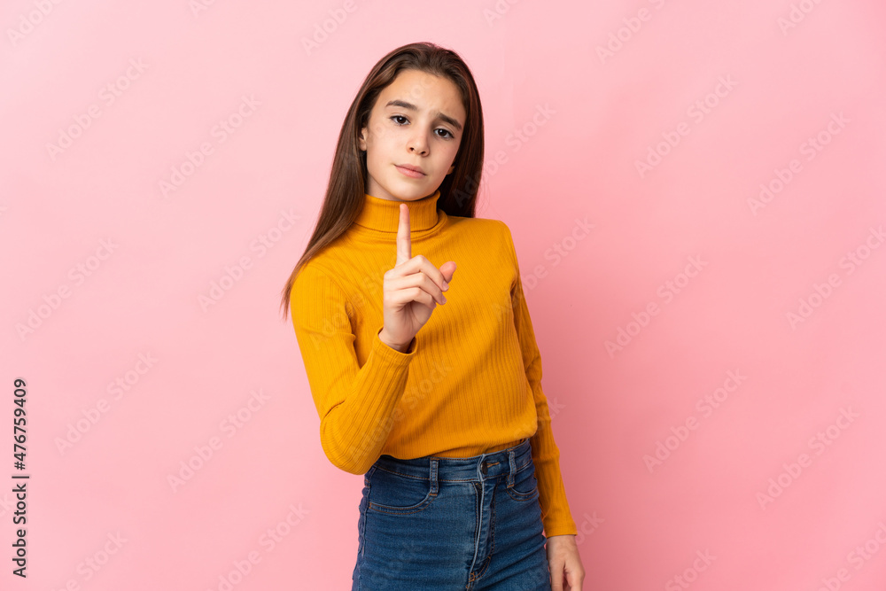 Little girl isolated on pink background frustrated and pointing to the front Little girl isolated on pink background frustrated and pointing to the front