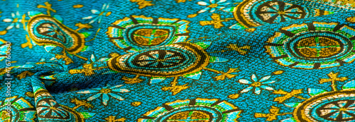 Texture background design, turquoise silk fabric with yellow dra