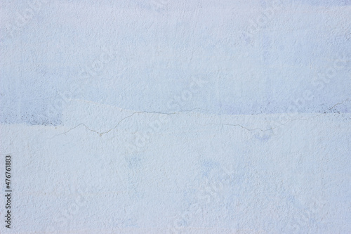 Beautiful blue concrete wall with crack in the middle texture