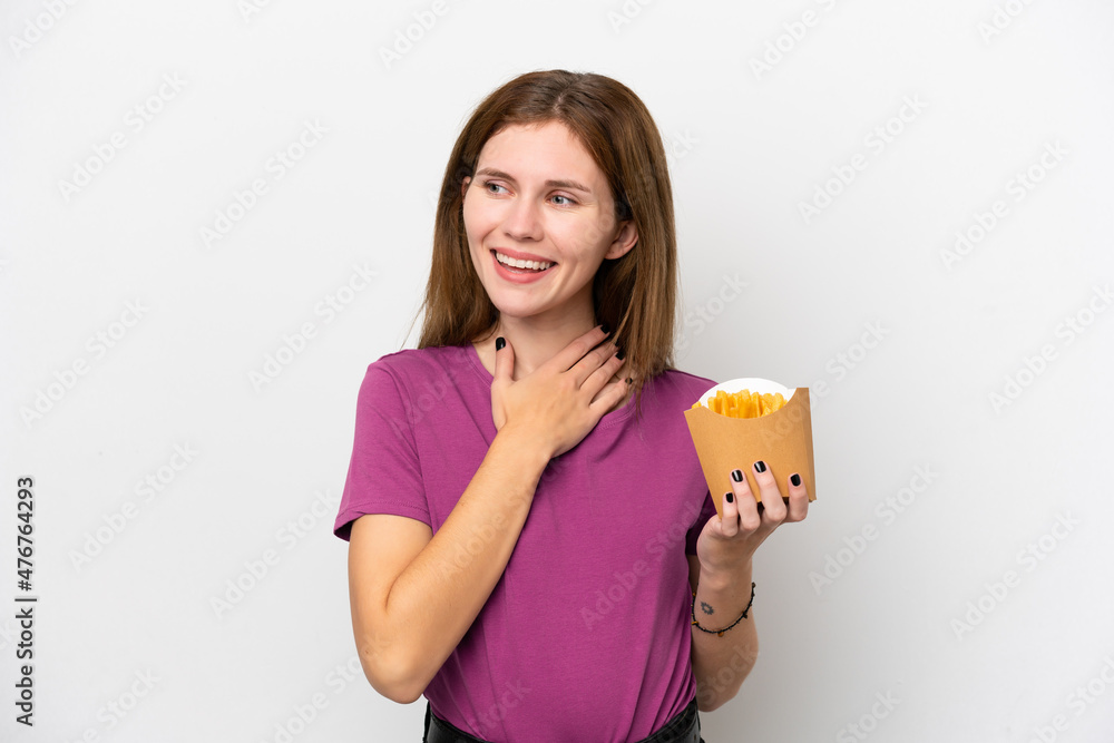 Young English woman holding fried chips isolated on white background looking up while smiling Young English woman holding fried chips isolated on white background looking up while smiling