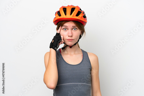 Young cyclist English woman isolated on white background thinking an idea