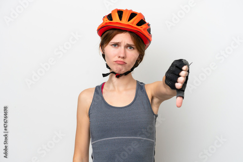 Young cyclist English woman isolated on white background showing thumb down with negative expression