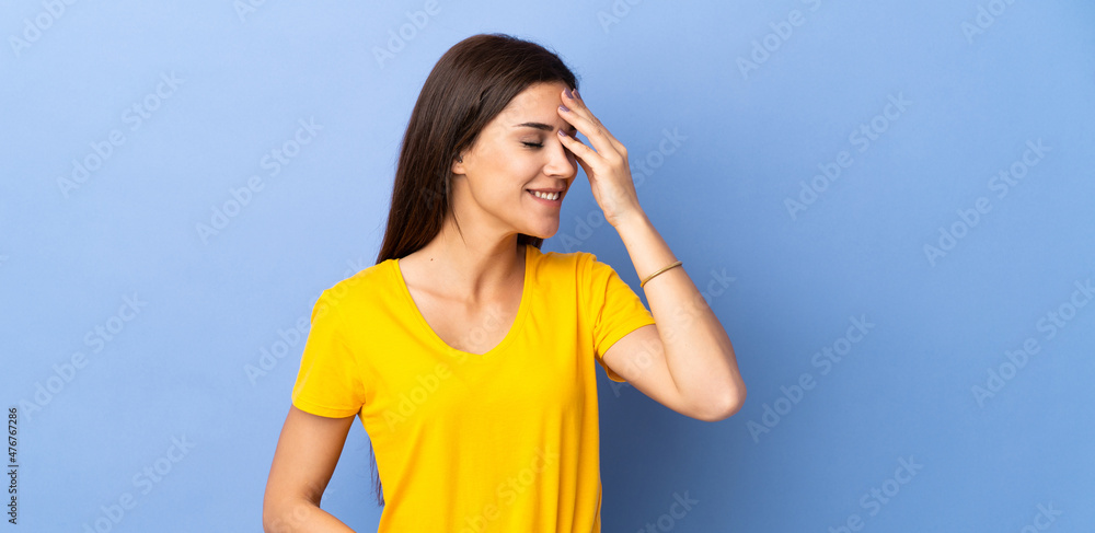 Young caucasian woman over isolated background laughing Young caucasian woman over isolated background laughing