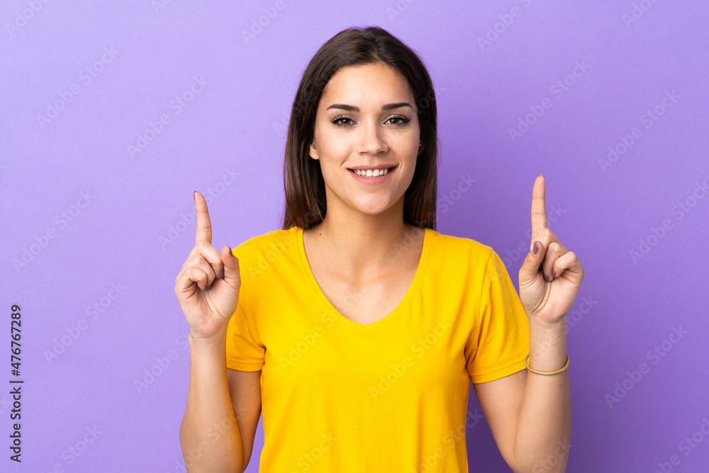 Young caucasian woman over isolated background pointing up a great idea Young caucasian woman over isolated background pointing up a great idea