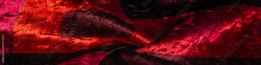 red yellow brown velvet fabric, dense fabric of silk, cotton or nylon with a thick short pile on one side. Texture, background, design