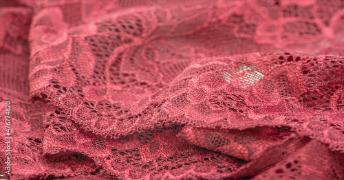 red lace. Elastic fashionable textile jacquard lace. Decorative item for sexy lingerie. elastic tapes. Home decor. Texture for your design. background. template.