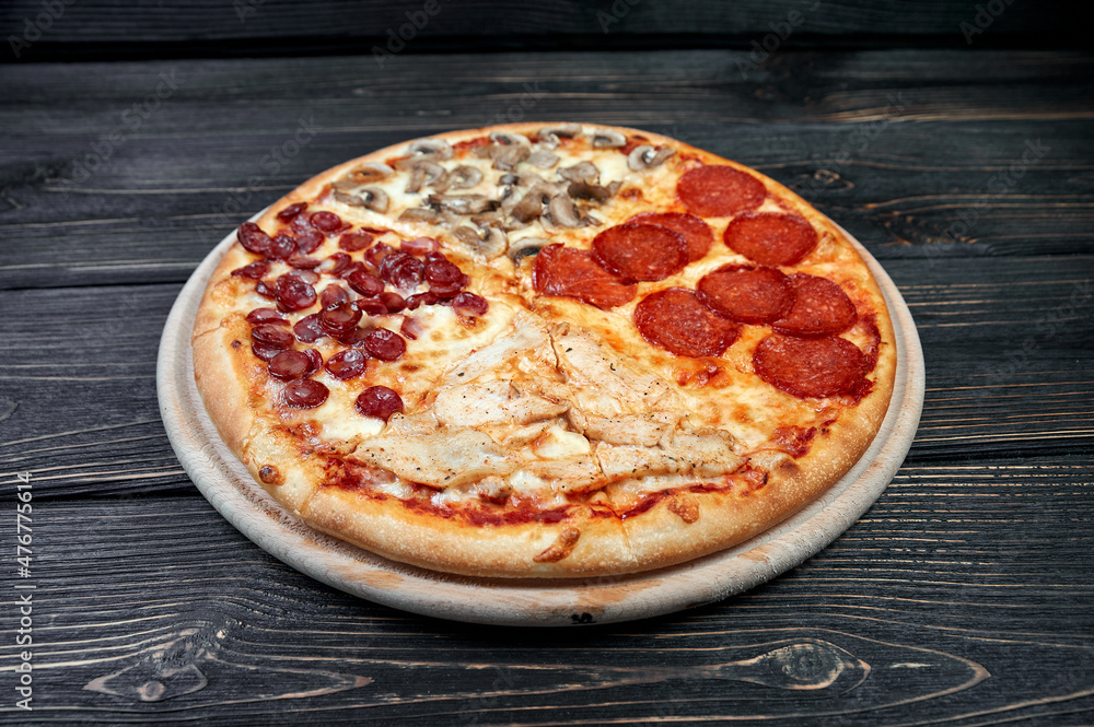Top view of Pizza Margherita on black background. Classic Italian Pizza Margarita with Tomato sause, Basil and Mozzarella Cheese Top view of Pizza Margherita on black background. Classic Italian Pizza Margarita with Tomato sause, Basil and Mozzarella Cheese